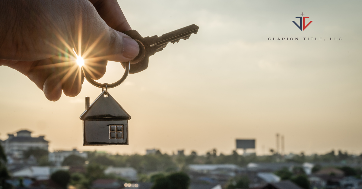 man holding key with house keychain