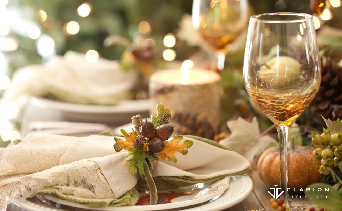 fall thanksgiving table plates, glasses, candles, greenery, place setting